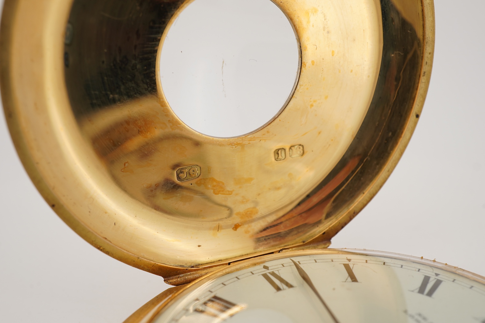 An Edwardian 18ct gold half hunter keyless lever pocket watch, by Searle & Co, Lombard Street, London